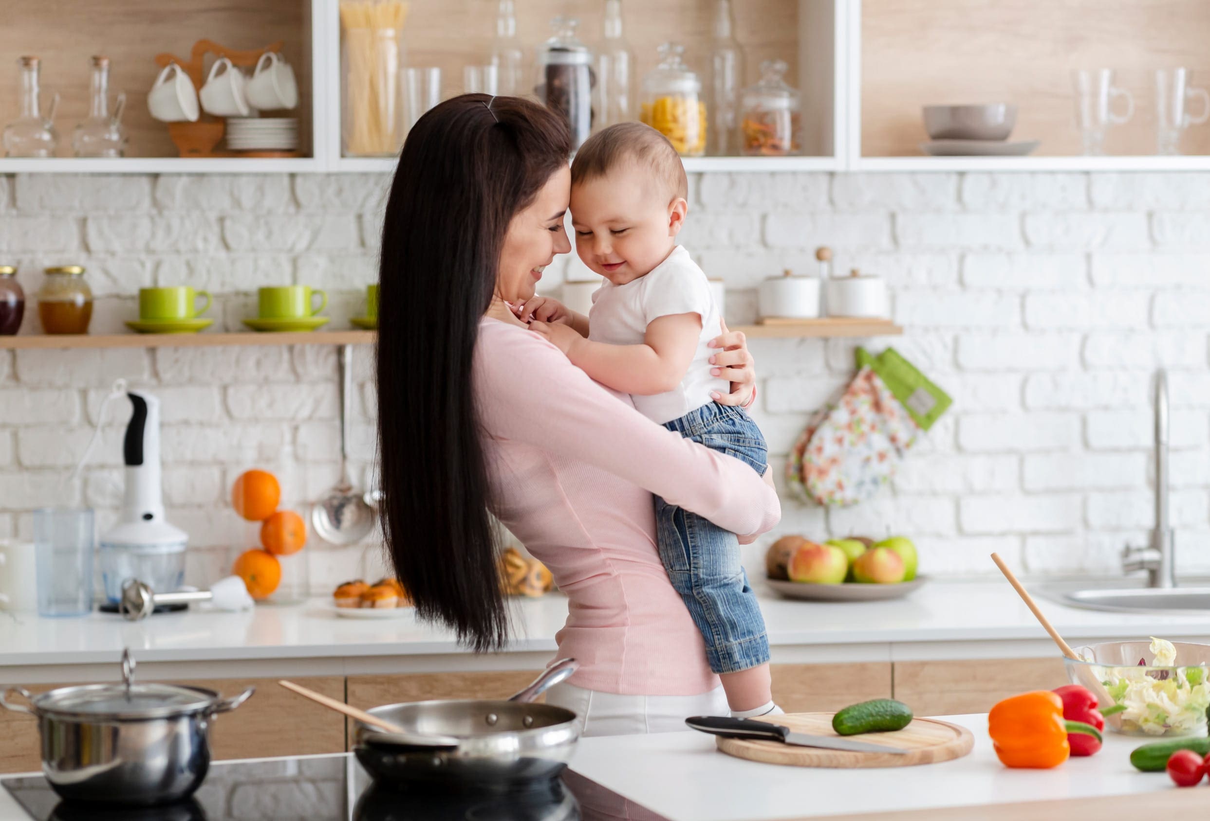 Mother making food for her baby with breast milk powder