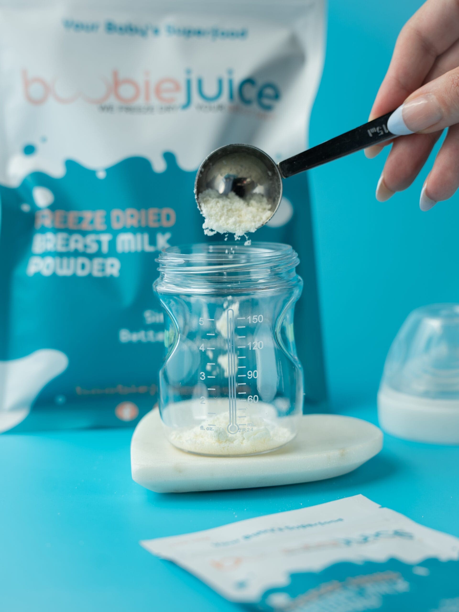 Fortifying a baby bottle with breast milk powder